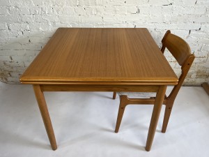 Lovely Scandinavian Modern draw-leaf teak dining table - perfect for small spaces - condo living - in excellent vintage condition - measures 33.25"square x 29"H - each leaf -