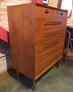 Exceptional Mid-century Modern teak highboy dresser - incredible quality craftsmanship - solid wood drawer fronts - incredible carved out pulls - so unique and the grain and patina is gorgeous - this is an investment that will keep on giving - pass it down to your children piece - 35.5"W x 17.75"D x 43"H - (SOLD)
