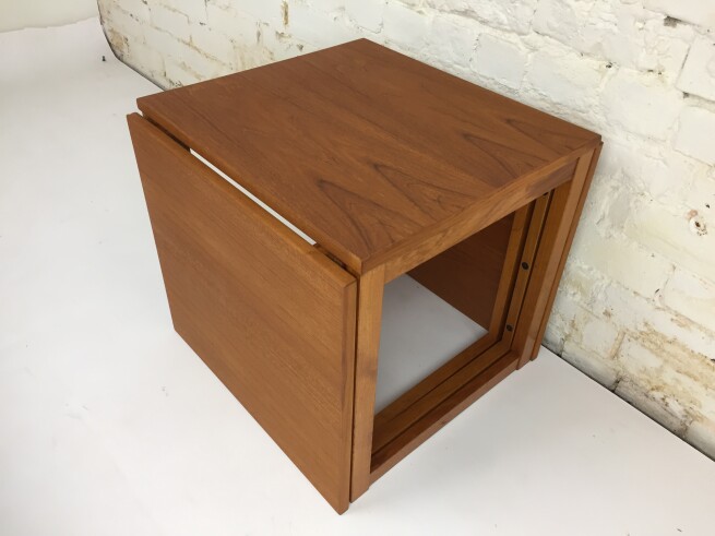 Incredible Set of three interlocking nesting table that form an open side and bottom cube. Two tables slide into the sides of the center table. Designed by Kai Kristiansen for Vildbjerg Møbelfabrik - newly refinished - measures -17.75"x 16" x 15.25"H