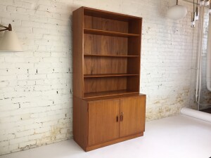 Outstanding Danish teak cabinet with bookshelf designed by Borge Mogensen for Soborg Mobler circa early 1960s. - Made in Denmark - incredible high quality craftsmanship that is in excellent vintage condition. Lower cabinet includes a single shelf that is height adjustable or removable, comes with the original key - the upper bookshelf piece features 3 adjustable shelves - no particle board in this beauty - measures - 39.25" Wx 18.25"D cabinet, 12.25"D display/bookcase, 71.75" H - $1500