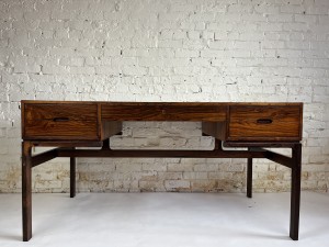 Scarce and absolutely stunning sleek osewood writing desk designed by Arne Wahl Iversen circa 50s/early 60s, produced by Vinde Mobelfabrik - recently refinished - measures - measures - 56.5"L x 28.75"D x 28.75"H (SOLD)