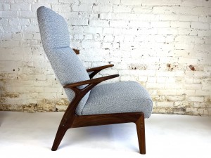 Gorm-Mobler, Denmark, circa 1960. It can be reclined and has an adjustable ottoman that pulls out from under the seat(which is cleverly hidden when not in use). The frame is solid teak - this beauty has been newly restored with new foam, durable high quality fabric by Maharam and refinished solid teak wood frame - $2900