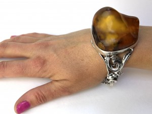 We couldn't resist this well made chunky amber bracelet with beautifully detailed silver work $400