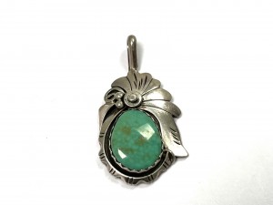 A vintage silver south west pendant marked sterling H S $100