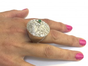 A fantastic silver cocktail ring with an emerald mounted with gold prongs 925 silver, no makers mark Size 7 $350