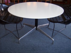 Fantastic low occasional table - would be great on your patio with 4 solair lawn chairs - the top of the table is white melamine and the base made by Herman Miller & designed by Charles and Ray Eames - the table top diameter is 41.75" and the height is 25" - (SOLD)